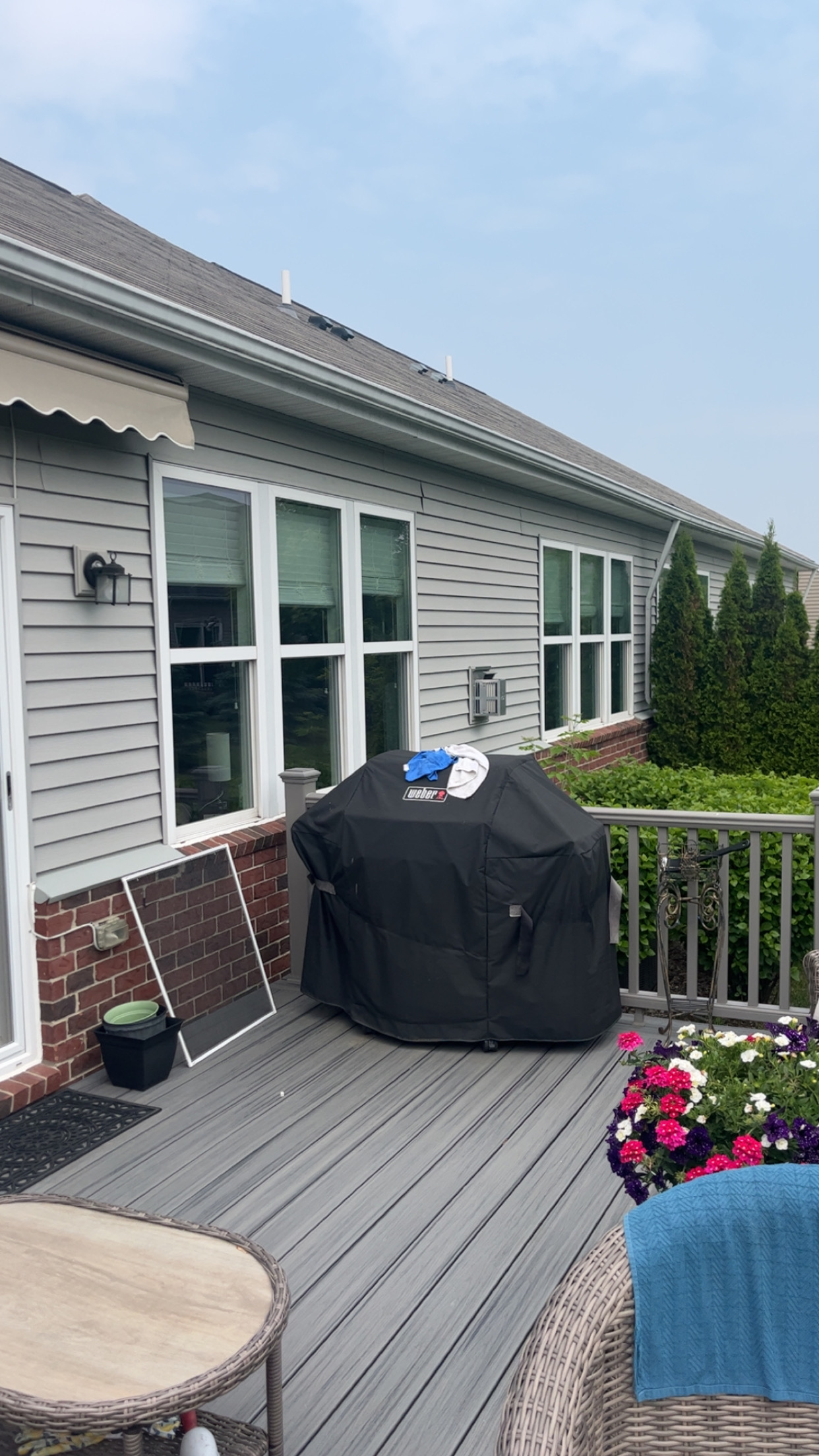 Exterior of home with clean windows and deck