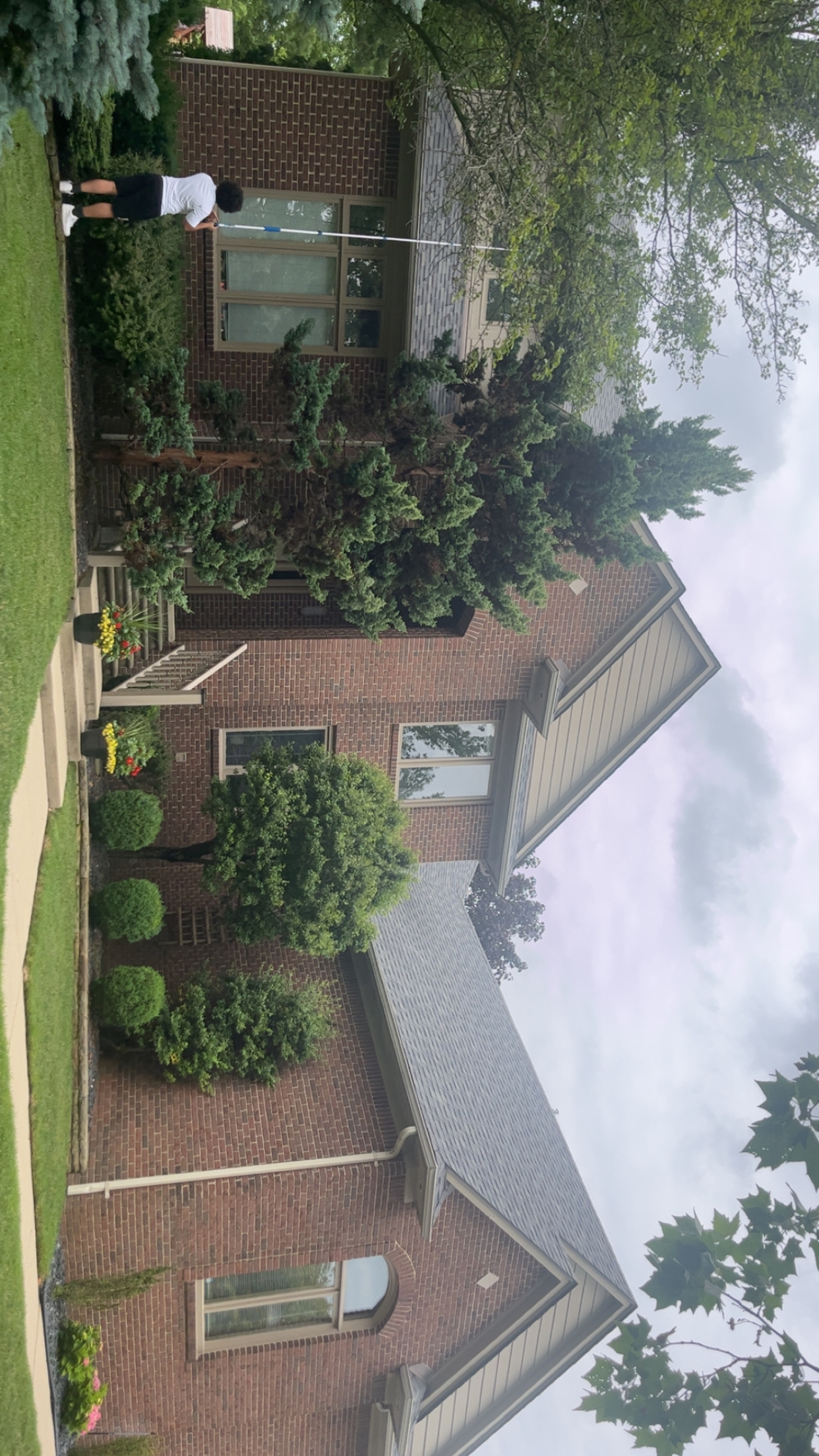 Aerial view of home with landscaping